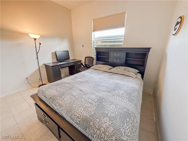 2041 24th Ave NE, Naples, FL 34120 - bedroom featuring light tile patterned flooring and baseboards