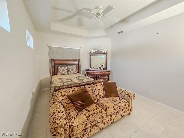 2041 24th Ave NE, Naples, FL 34120 - bedroom featuring a tray ceiling, ceiling fan, and light tile patterned floors