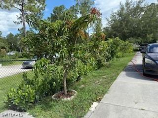 2041 24th Ave NE, Naples, FL 34120 - view of home's community with a yard
