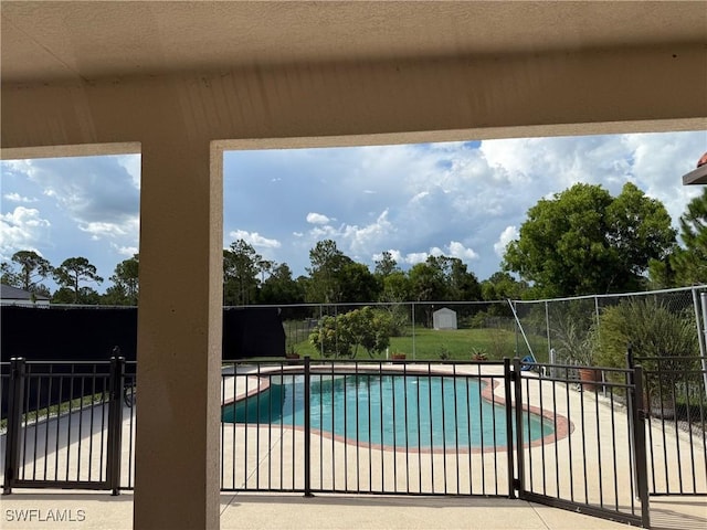 2041 24th Ave NE, Naples, FL 34120 - view of swimming pool featuring a patio