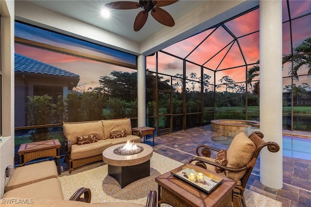 8331 Adelio Ln, Fort Myers, FL 33912 - patio terrace at dusk featuring an outdoor living space with a fire pit, a patio, a lanai, and a pool with connected hot tub