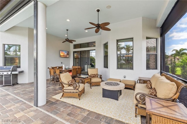 8331 Adelio Ln, Fort Myers, FL 33912 - view of patio featuring an outdoor living space with a fire pit, grilling area, outdoor dining area, and a ceiling fan