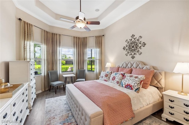 8331 Adelio Ln, Fort Myers, FL 33912 - bedroom featuring wood finished floors, a raised ceiling, and a ceiling fan