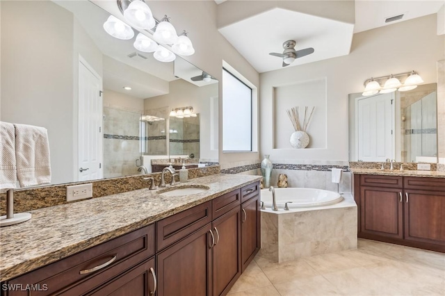 8331 Adelio Ln, Fort Myers, FL 33912 - full bath featuring a stall shower, two vanities, a bath, and a ceiling fan