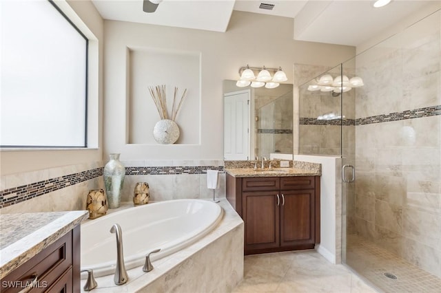 8331 Adelio Ln, Fort Myers, FL 33912 - full bathroom featuring vanity, a bath, and a stall shower