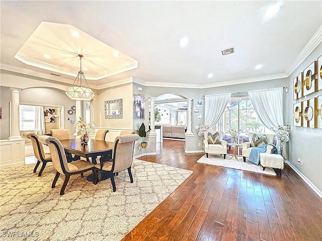 3032 Via Rialto St, Fort Myers, FL 33905 - dining area with ornate columns, arched walkways, dark wood-style flooring, ornamental molding, and recessed lighting