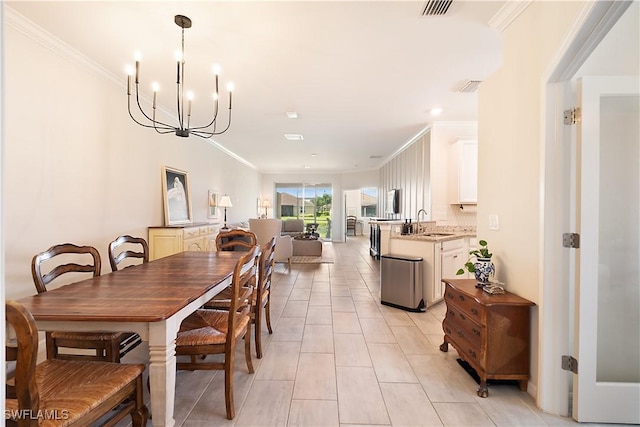 2042 Tamarron Ln, Naples, FL 34120 - dining space featuring a chandelier, ornamental molding, light tile patterned flooring, and recessed lighting