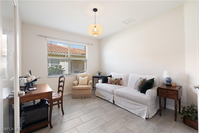 2042 Tamarron Ln, Naples, FL 34120 - living area with light tile patterned floors and a desk