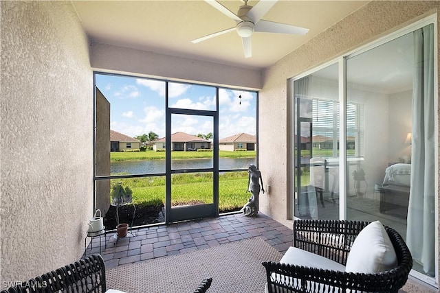 2042 Tamarron Ln, Naples, FL 34120 - sunroom featuring a water view and a ceiling fan