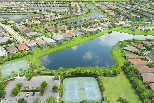 2042 Tamarron Ln, Naples, FL 34120 - aerial view of property and surrounding area featuring nearby suburban area and a large body of water