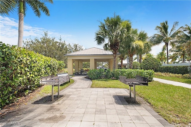 2042 Tamarron Ln, Naples, FL 34120 - view of community featuring a gazebo, a lawn, and a patio