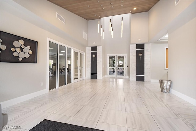 2042 Tamarron Ln, Naples, FL 34120 - community lobby with a towering ceiling and recessed lighting