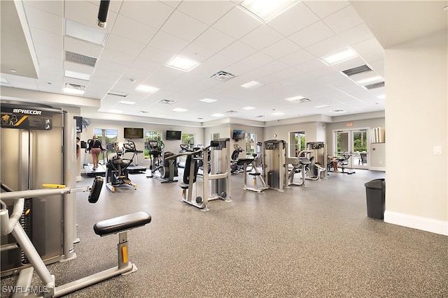 2042 Tamarron Ln, Naples, FL 34120 - exercise room featuring a paneled ceiling