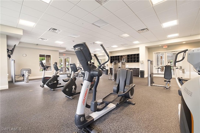 2042 Tamarron Ln, Naples, FL 34120 - workout area featuring a drop ceiling and baseboards