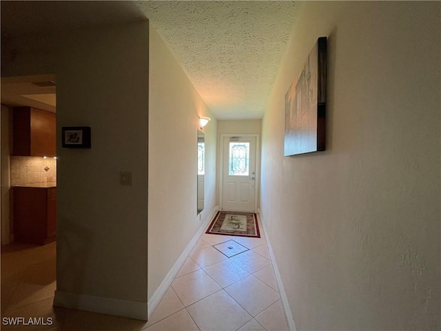 1414 SE 46th St Unit 1C, Cape Coral, FL 33904 - corridor with a textured ceiling and light tile patterned floors