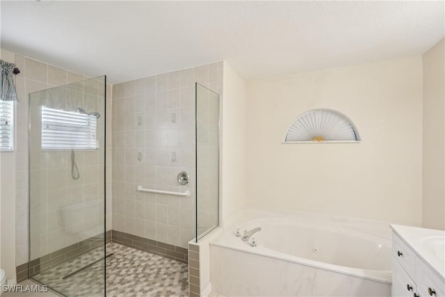 13671 Willow Bridge Dr, North Fort Myers, FL 33903 - bathroom with a jetted tub, tiled shower, and vanity