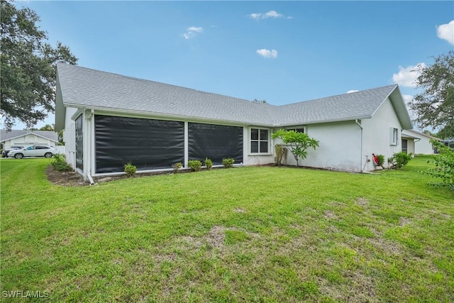 13671 Willow Bridge Dr, North Fort Myers, FL 33903 - back of property with a lawn and stucco siding