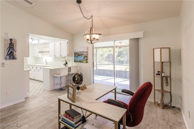 13611 Marquette Blvd, Fort Myers, FL 33905 - office featuring light wood finished floors, a chandelier, lofted ceiling, and a textured ceiling