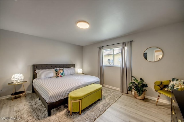 917 SW 23rd St, Cape Coral, FL 33991 - bedroom featuring light wood-type flooring and baseboards