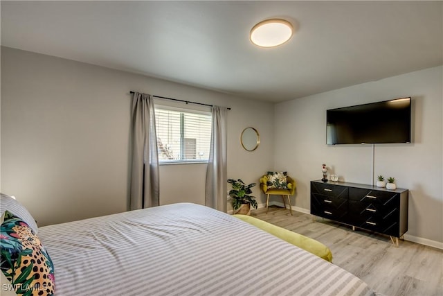 917 SW 23rd St, Cape Coral, FL 33991 - bedroom featuring light wood-style floors and baseboards