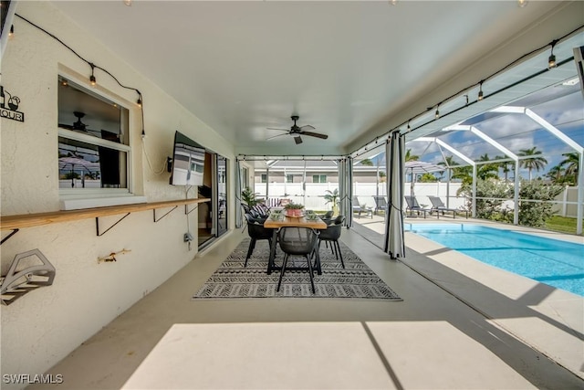 917 SW 23rd St, Cape Coral, FL 33991 - view of swimming pool featuring a ceiling fan, a patio area, glass enclosure, and outdoor dining space