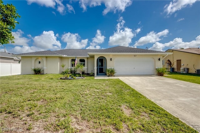 917 SW 23rd St, Cape Coral, FL 33991 - single story home with stucco siding, an attached garage, and concrete driveway