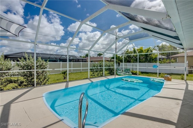 917 SW 23rd St, Cape Coral, FL 33991 - view of swimming pool with a fenced backyard, a patio area, and a lanai