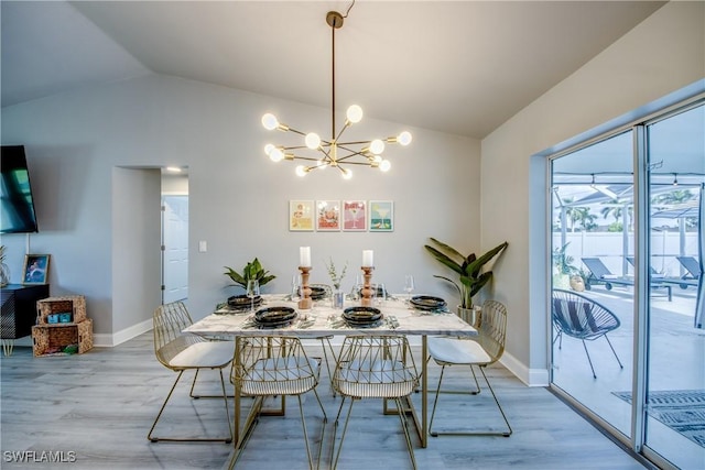 917 SW 23rd St, Cape Coral, FL 33991 - dining space with lofted ceiling, light wood-type flooring, and a chandelier