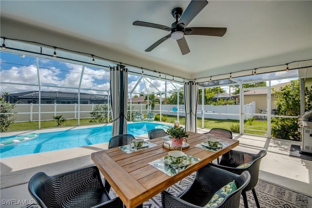 917 SW 23rd St, Cape Coral, FL 33991 - sunroom / solarium featuring a ceiling fan and a swimming pool