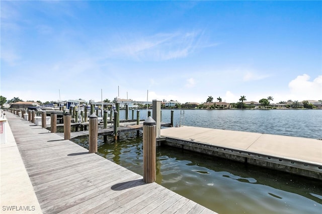380 Seaview Ct Unit 1505, Marco Island, FL 34145 - dock with a water view and boat lift