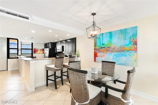 380 Seaview Ct Unit 1505, Marco Island, FL 34145 - dining area featuring light tile patterned floors, crown molding, a chandelier, and recessed lighting