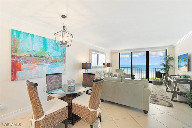 380 Seaview Ct Unit 1505, Marco Island, FL 34145 - dining area with crown molding, a chandelier, light tile patterned floors, a water view, and floor to ceiling windows