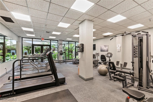 380 Seaview Ct Unit 1505, Marco Island, FL 34145 - exercise room featuring plenty of natural light, a drop ceiling, and carpet