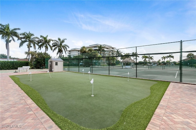 380 Seaview Ct Unit 1505, Marco Island, FL 34145 - view of home's community featuring a tennis court, a putting green, and a storage shed