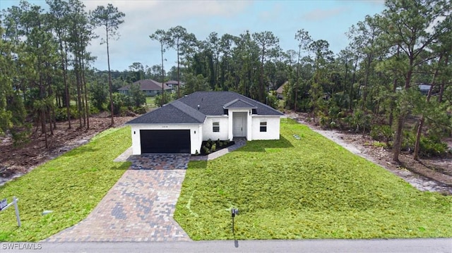 1518 Williams Ave, Lehigh Acres, FL 33972 - view of front of home featuring decorative driveway, a garage, a front lawn, and stucco siding