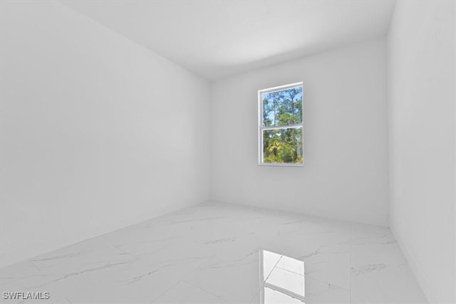 1518 Williams Ave, Lehigh Acres, FL 33972 - unfurnished room featuring marble finish floors