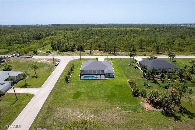 291 Rotonda Blvd S, Rotonda West, FL 33947 - aerial view of property and surrounding area with a heavily wooded area