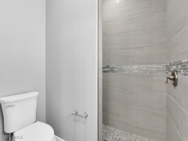 291 Rotonda Blvd S, Rotonda West, FL 33947 - full bathroom with a tile shower and toilet
