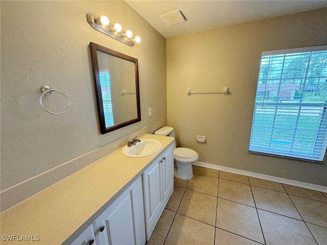 4916 7th St W, Lehigh Acres, FL 33971 - bathroom featuring plenty of natural light, vanity, and tile patterned floors