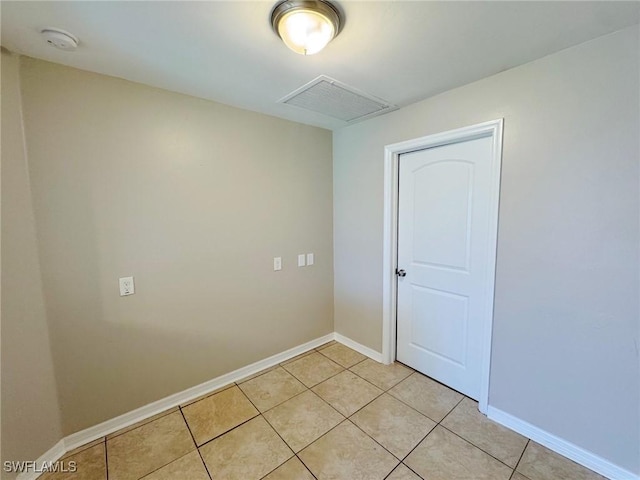4916 7th St W, Lehigh Acres, FL 33971 - empty room featuring a smoke detector and light tile patterned floors