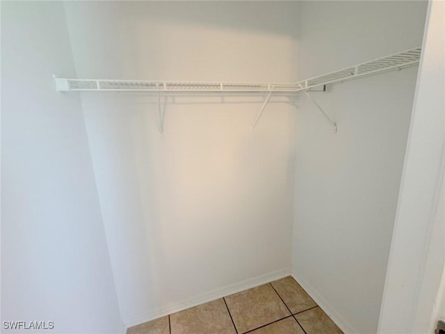 4916 7th St W, Lehigh Acres, FL 33971 - spacious closet featuring light tile patterned floors