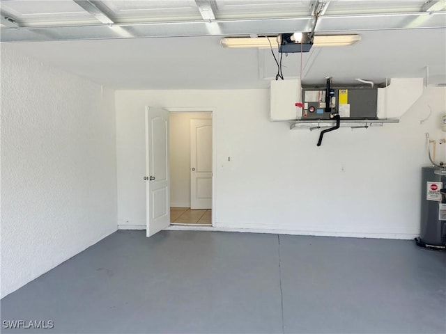 4916 7th St W, Lehigh Acres, FL 33971 - garage featuring electric water heater and a garage door opener