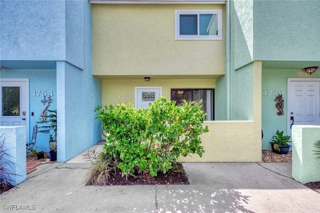 1752 Stickney Point Rd Unit 102, Sarasota, FL 34231 - property entrance featuring stucco siding