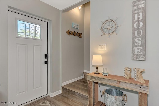 1752 Stickney Point Rd Unit 102, Sarasota, FL 34231 - foyer entrance featuring wood finished floors and baseboards