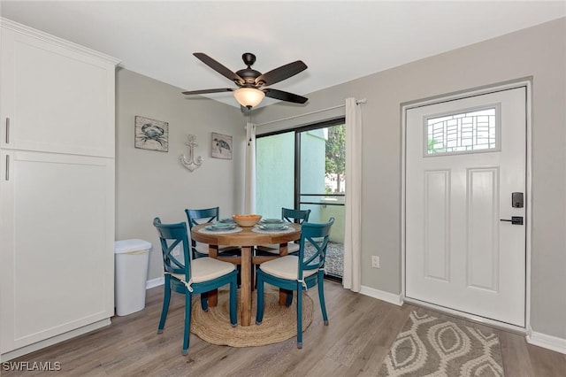 1752 Stickney Point Rd Unit 102, Sarasota, FL 34231 - dining room featuring light wood finished floors and ceiling fan
