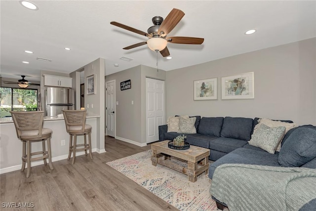 1752 Stickney Point Rd Unit 102, Sarasota, FL 34231 - living area featuring a ceiling fan, light wood-type flooring, and recessed lighting