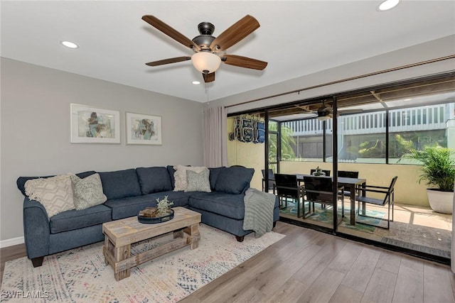 1752 Stickney Point Rd Unit 102, Sarasota, FL 34231 - living area featuring wood finished floors, ceiling fan, and recessed lighting