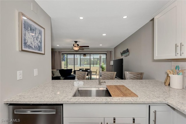 1752 Stickney Point Rd Unit 102, Sarasota, FL 34231 - kitchen with dishwasher, a ceiling fan, white cabinets, light stone counters, and recessed lighting