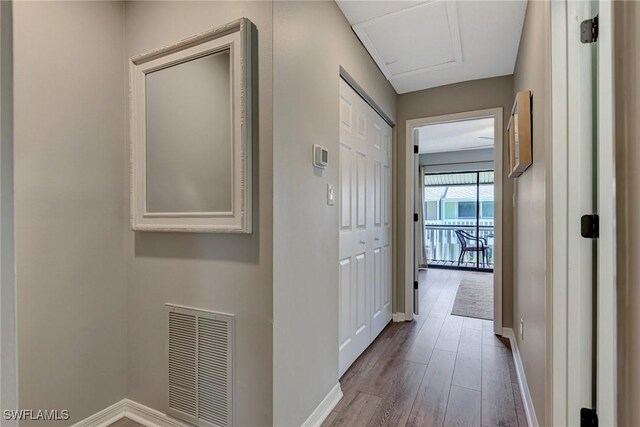 1752 Stickney Point Rd Unit 102, Sarasota, FL 34231 - hallway with wood finished floors and baseboards