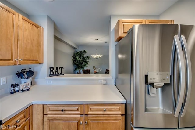 9470 Ivy Brook Run Unit 803, Fort Myers, FL 33913 - kitchen with stainless steel fridge, light countertops, and pendant lighting